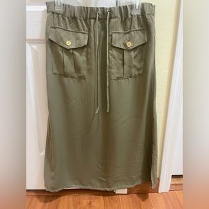 Military style safari green Midi skirt. Side slits. Elastic waist.       Size 6